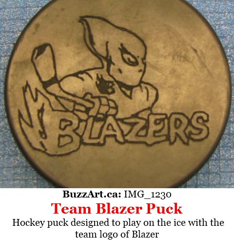 Hockey puck designed to play on the ice with the team logo of Blazer